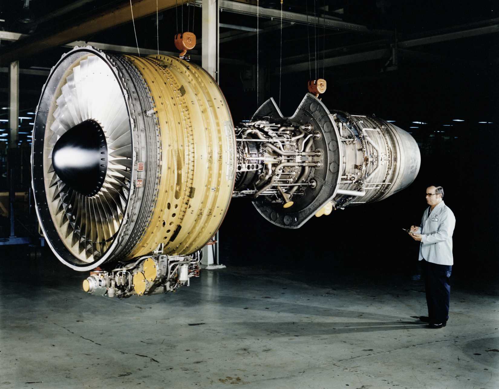 A CF6 turbofan engine photographed suspended by cables in a laboratory in 1979.