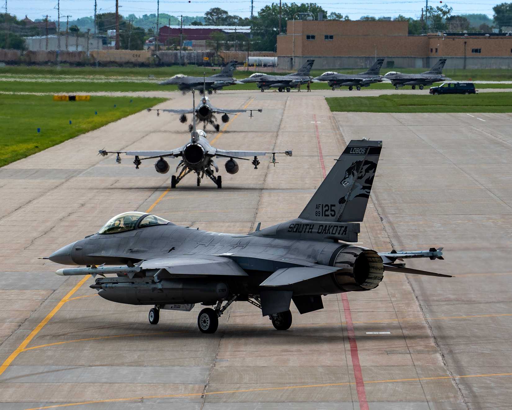 F-16 Fighting Falcons assigned to the 114th Fighter Wing taxi to the flight line while conducting an elephant walk at Joe Foss Field, South Dakota, July 2, 2025.