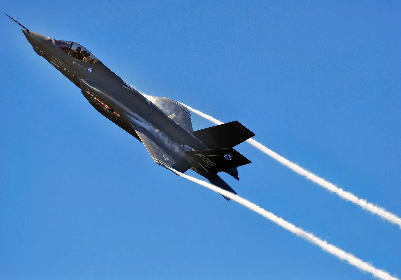 F-35 flying through a blue sky