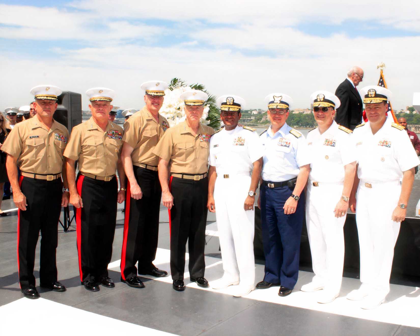 Generals and Admirals of various services pose for a photograph on the USS Intrepid