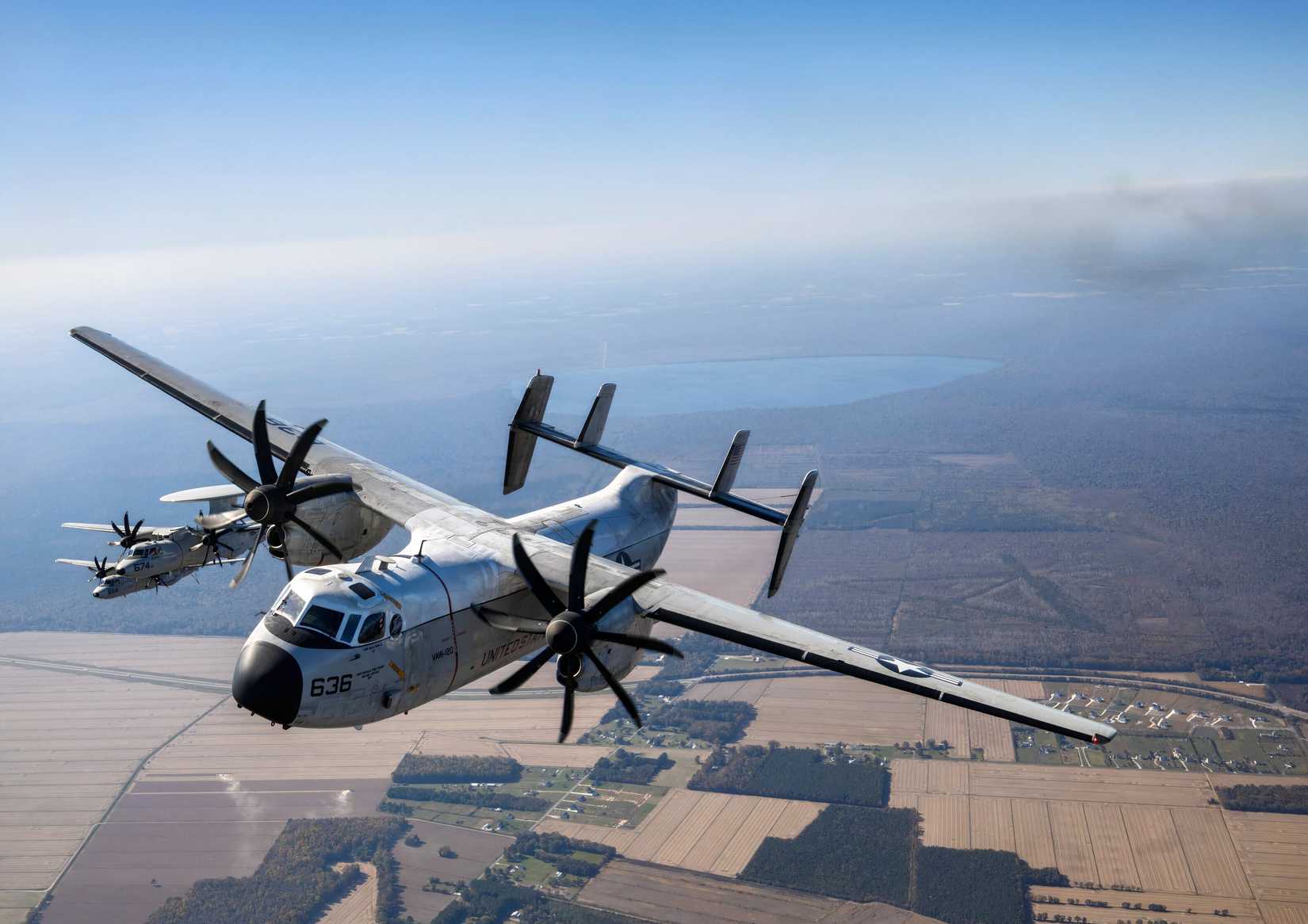 C-2A Greyhound flying over the Wright Brothers First Flight memorial at Kill Devil Hills, N.C.