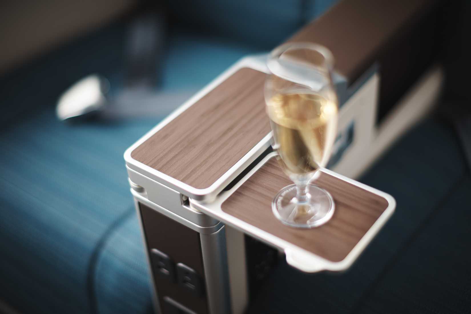 A350-900 Premium Economy Class seat with a glass of prosecco