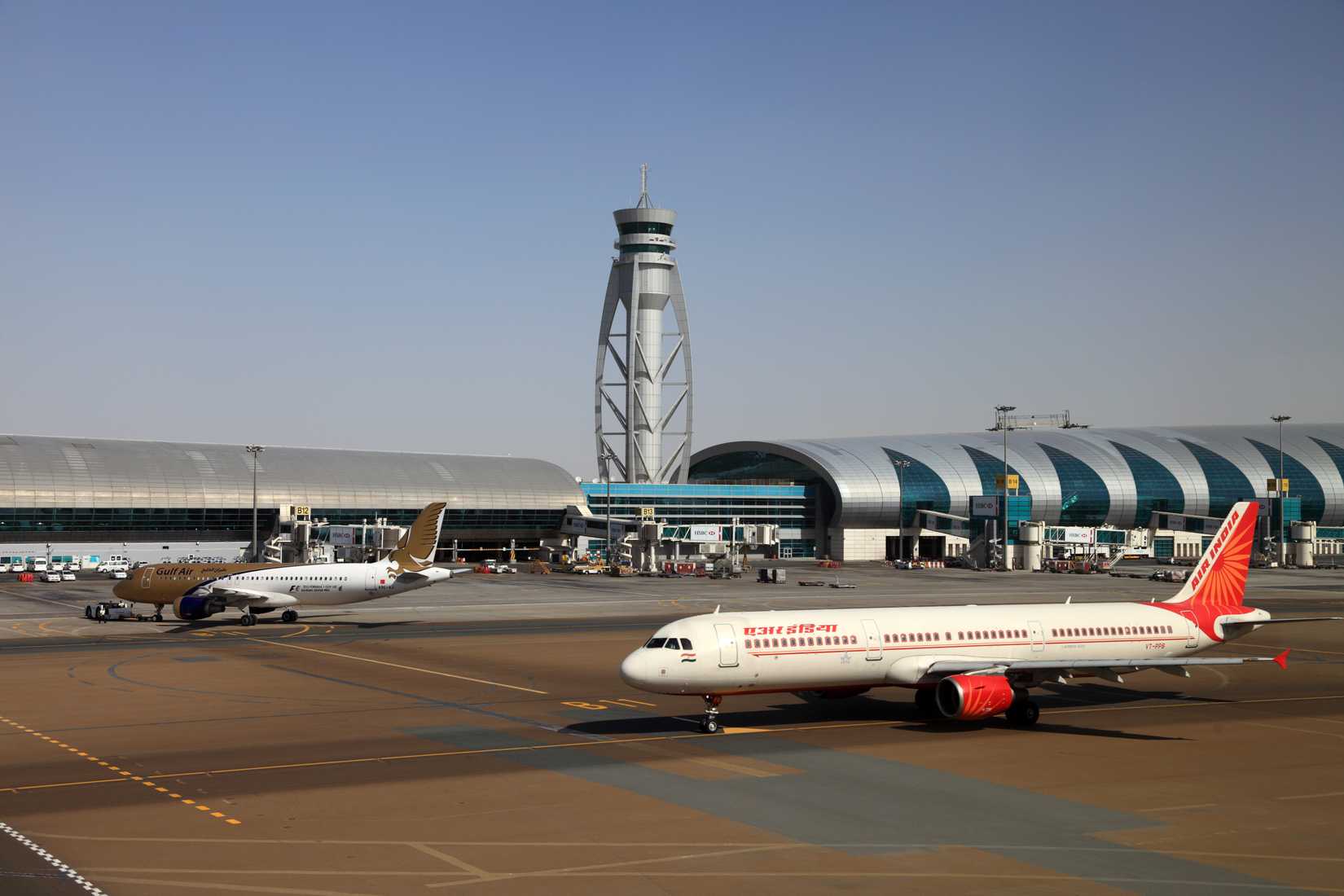 ir India and Gulf Air airplanes at Dubai Airport.