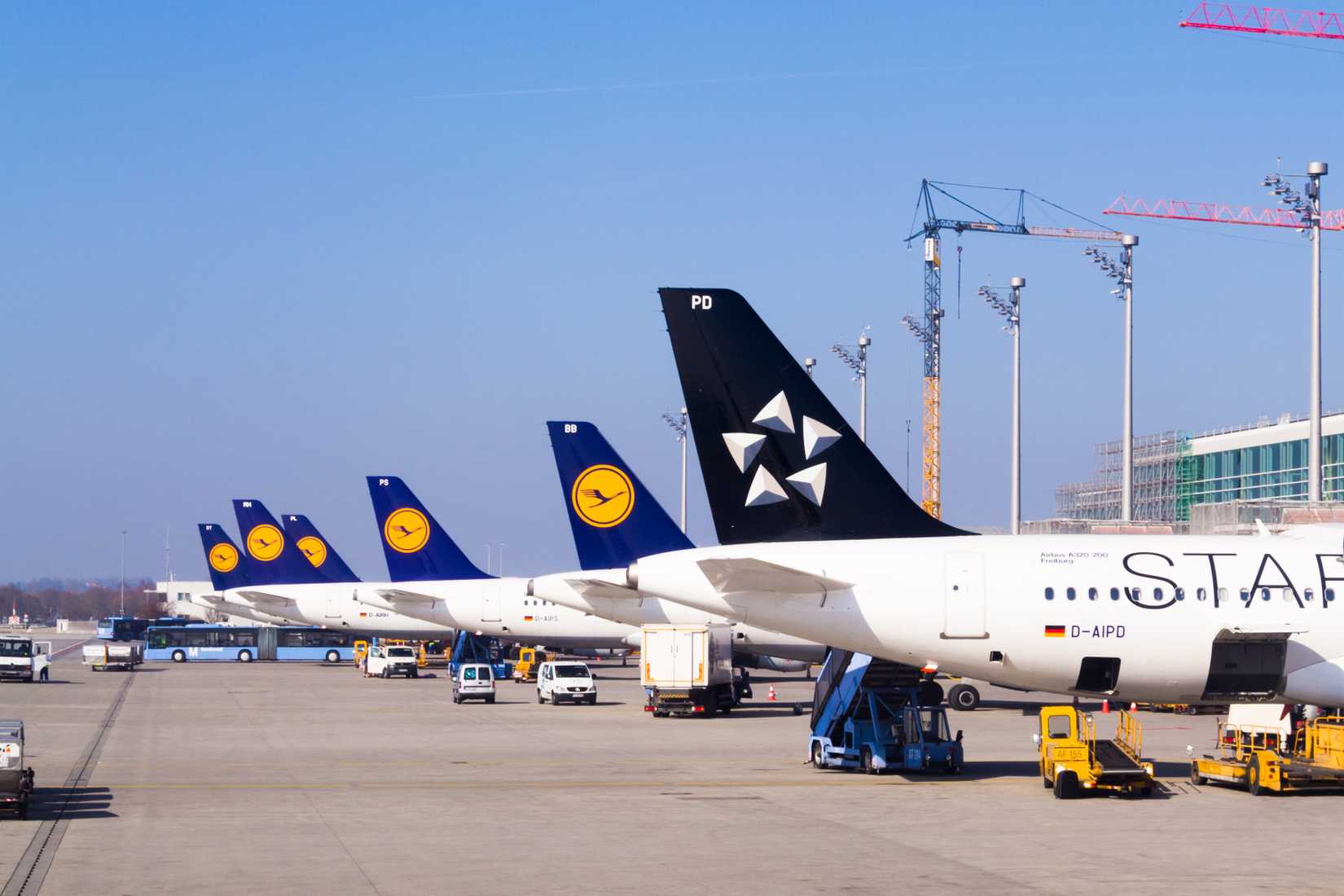 Multiple Lufthansa aircraft parked next to each out