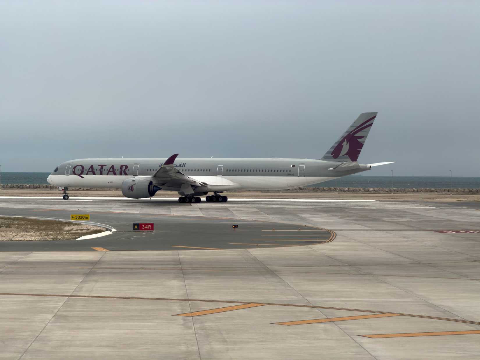 Qatar Airways Airbus A350-1000 ready to departure on runway at Hamad International Airport Doha, Qatar.