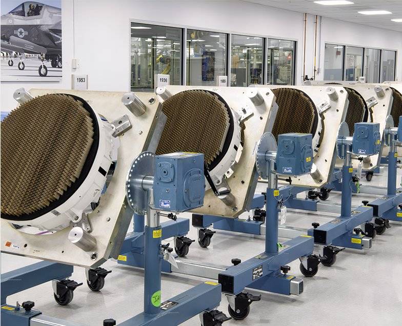 A photo of F-35 radar on multi-position fixtures at a manufacturing facility.