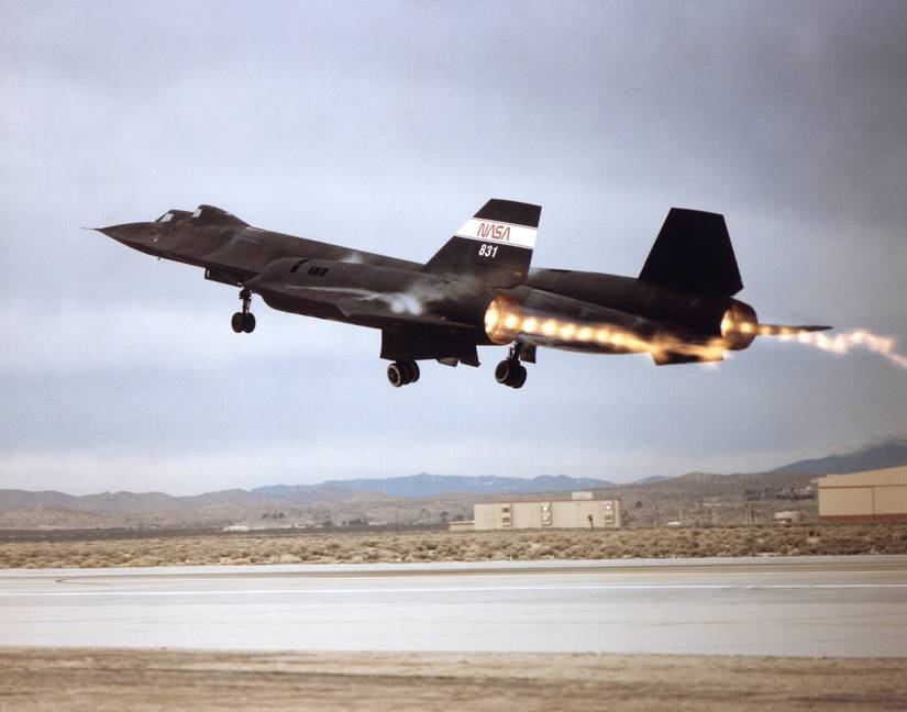 Shock waves stream from the exhaust nozzles of the two engines of NASA's SR-71B as it leaves the runway on a 1992 flight from the Ames-Dryden Flight Research Facility, Edwards, California.