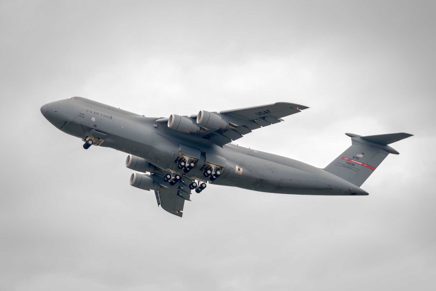 A C-5 cargo aircraft takes off from a Massachusetts military base.