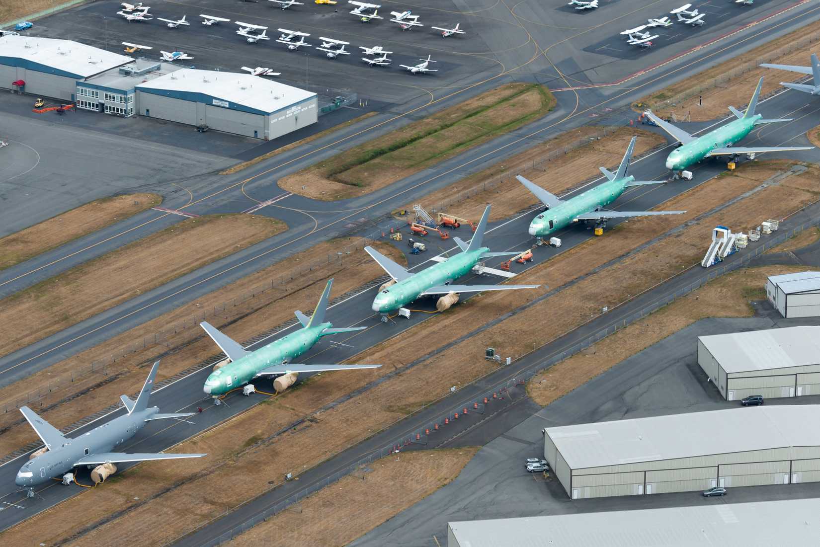 Runway closed at Paine Field with lots of United States Air Force KC-46 Pegasus aircraft stored. Aircraft will be used by USAF for aerial refueling.