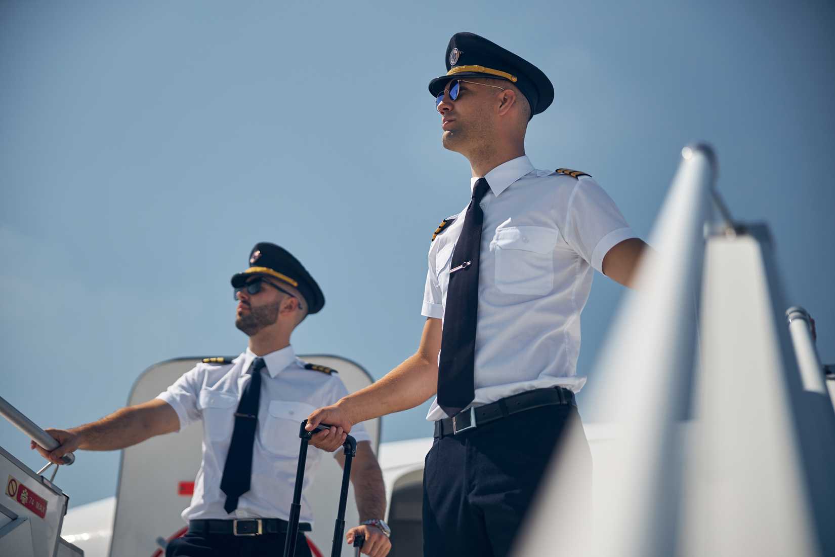 Pilots Standing Outside Aircraft