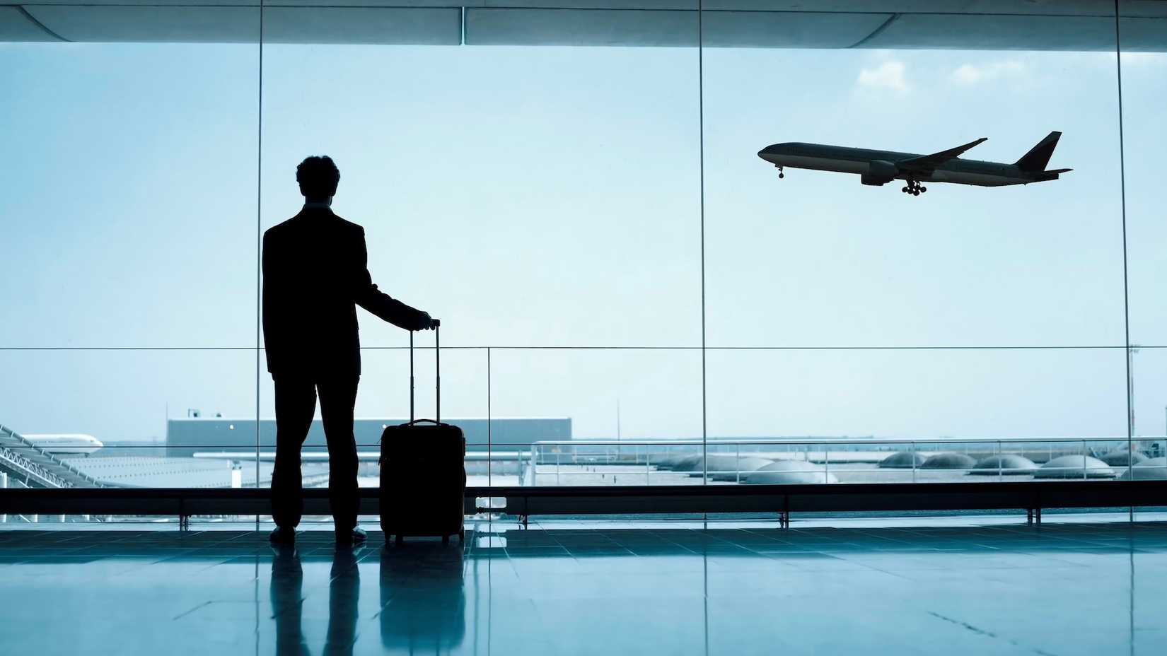 A Passenger Watching An Aircraft Depart