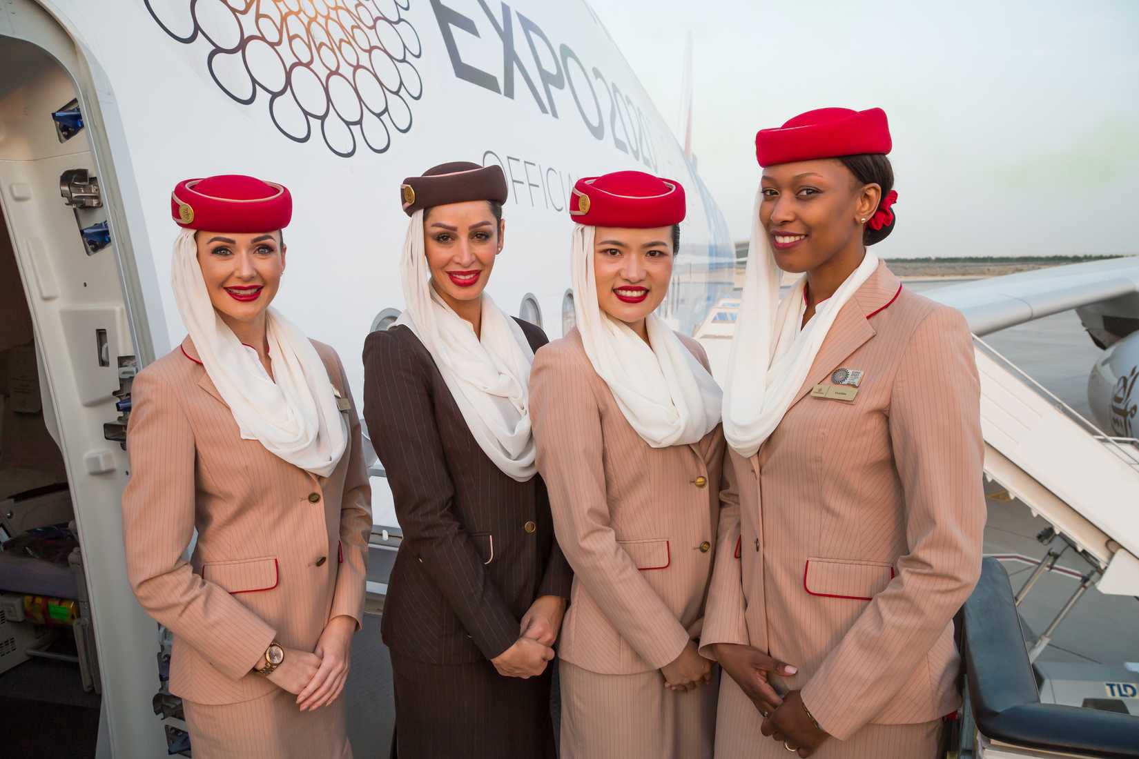 Emirates cabin crew on aircraft steps