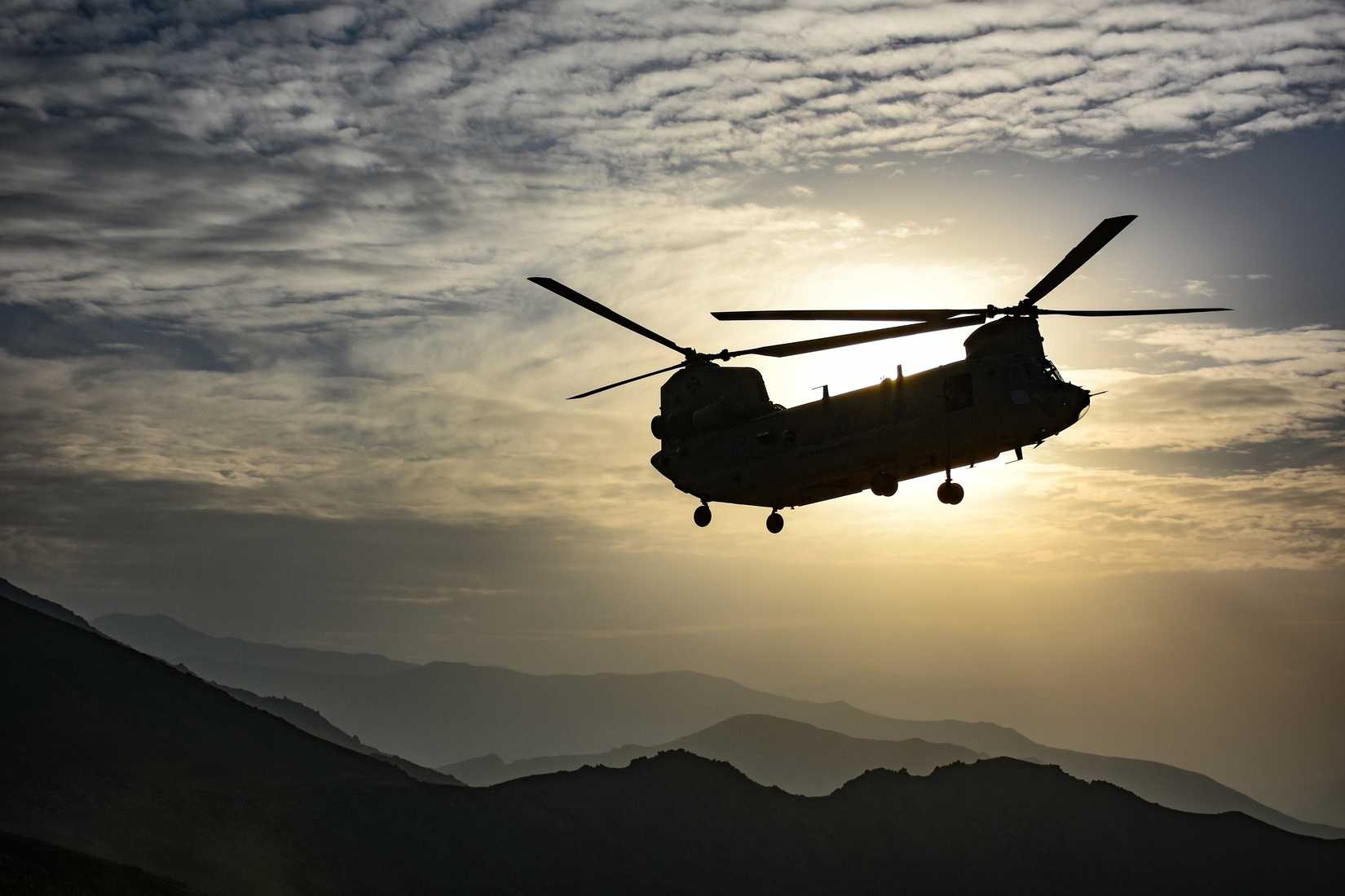 CH-47F Chinook army helicopter desert mountains