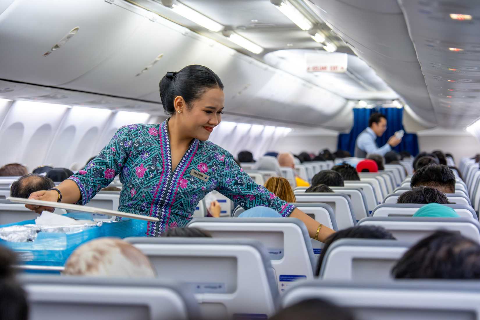 Malaysia Airlines flight attendant in cabin