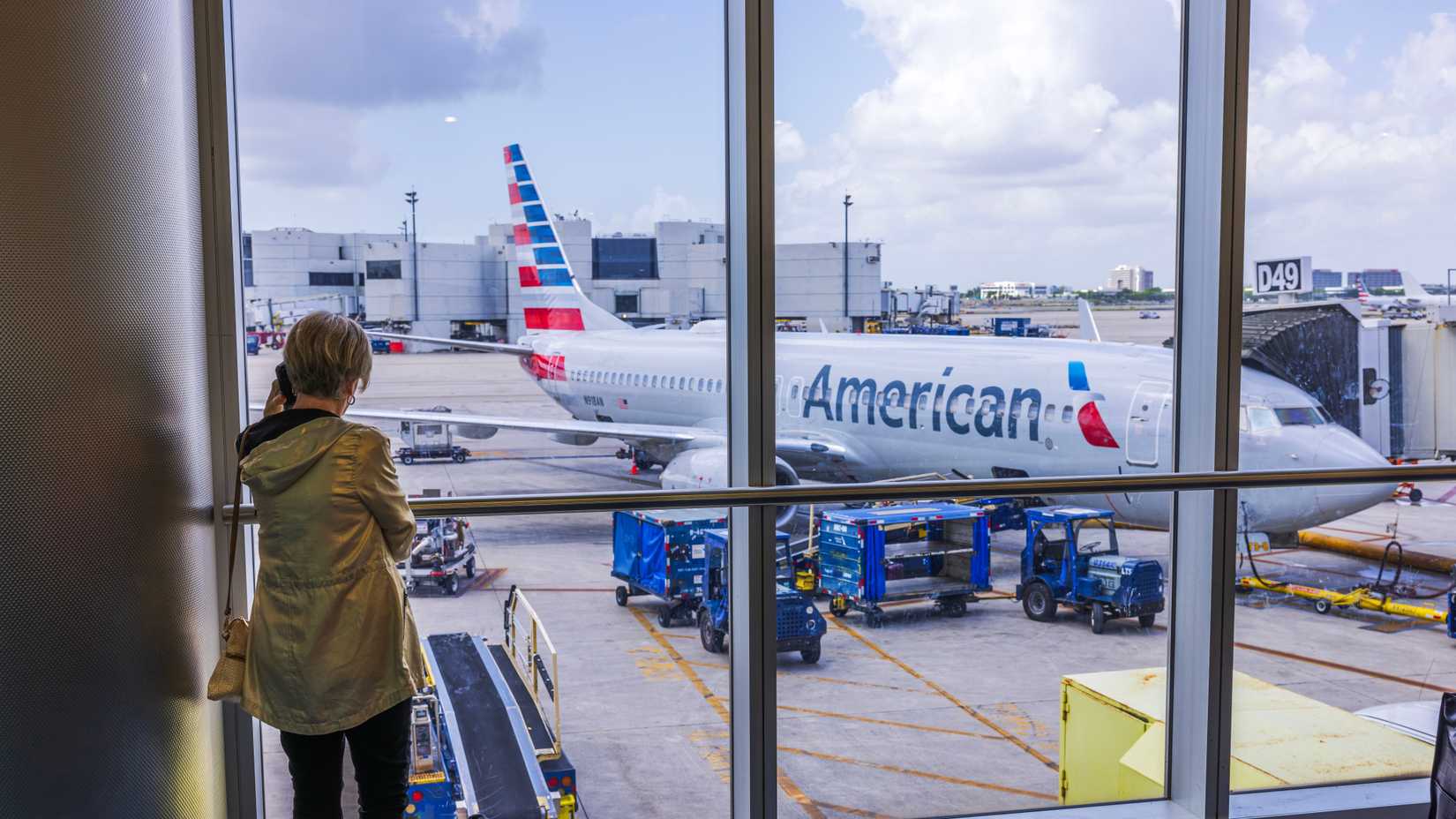 american airlines plane through a terminal window