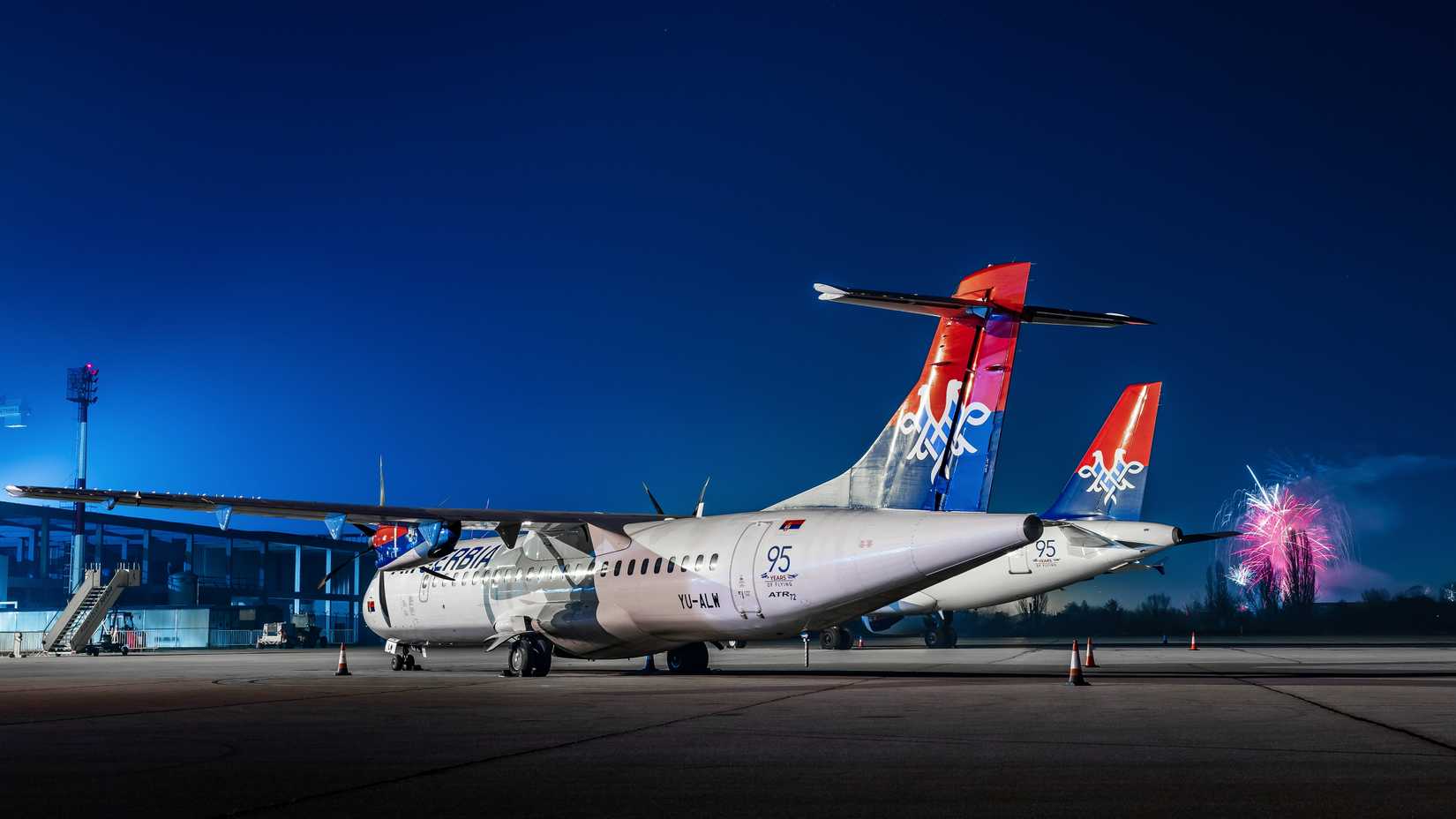 air serbia planes parked with fireworks in the background