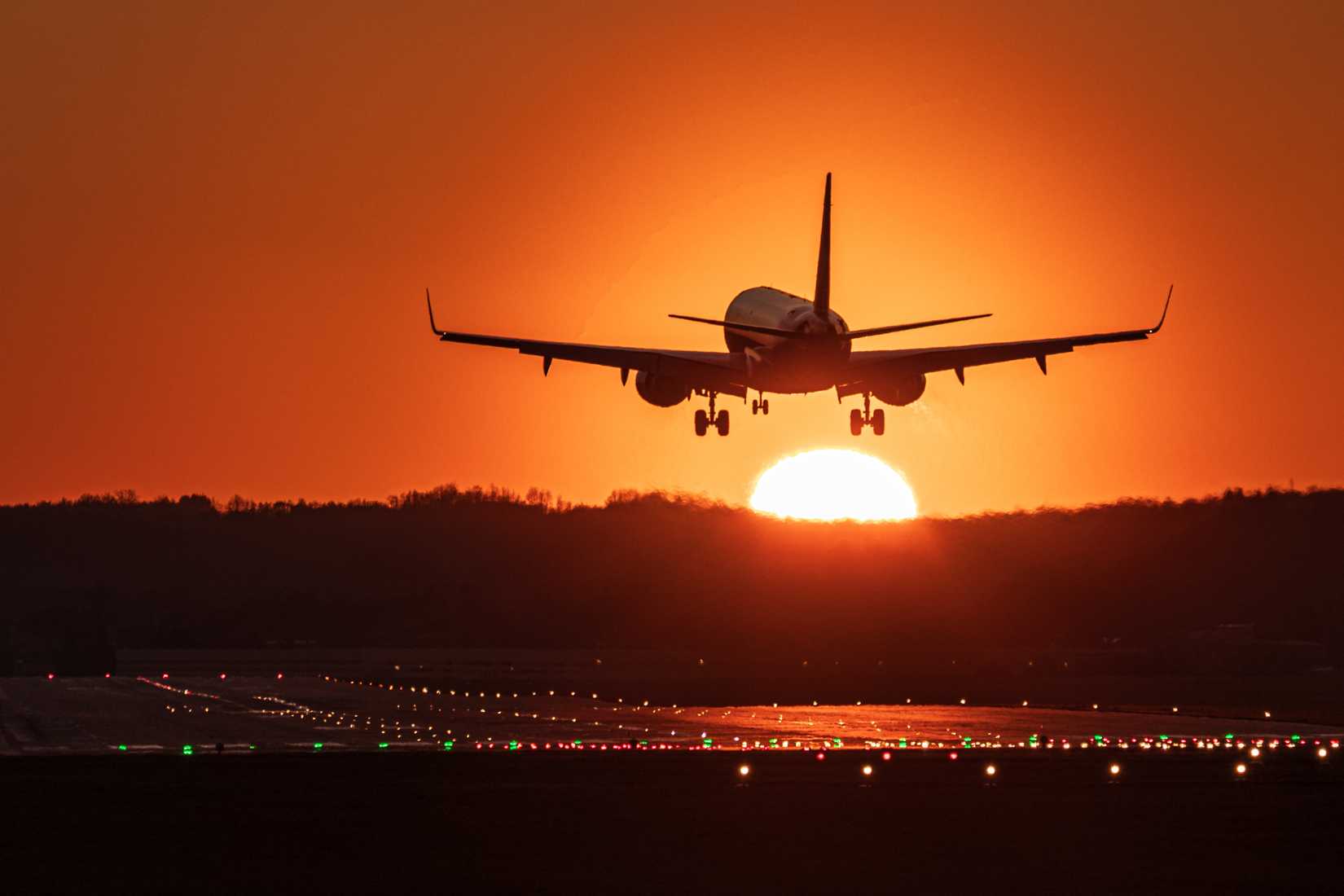 Narrowbody Twinjet Airliner Landing At Sunset