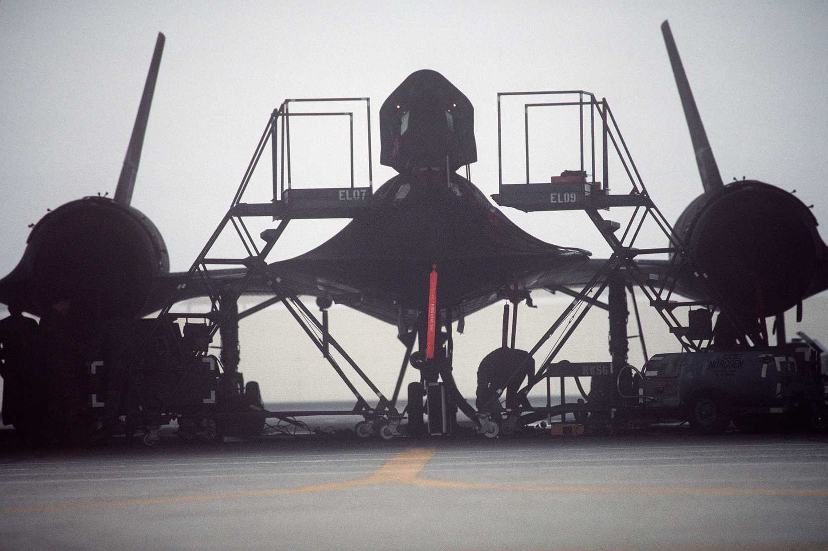 Silhouette of a 9th Strategic Reconnaissance Wing's SR-71 Blackbird reconnaissance aircraft and maintenance stands in its hangar at Beale Air Force Base, California.