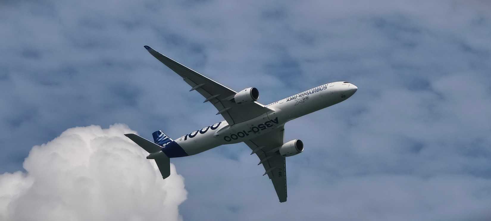 Singapore, 10 Feb 2026. Airbus A350‑1000 aircraft banking left in mid‑flight.