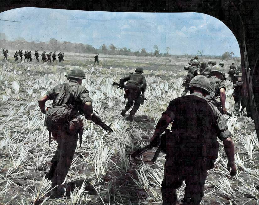 Soldiers In Vietnam Exit A Helicopter