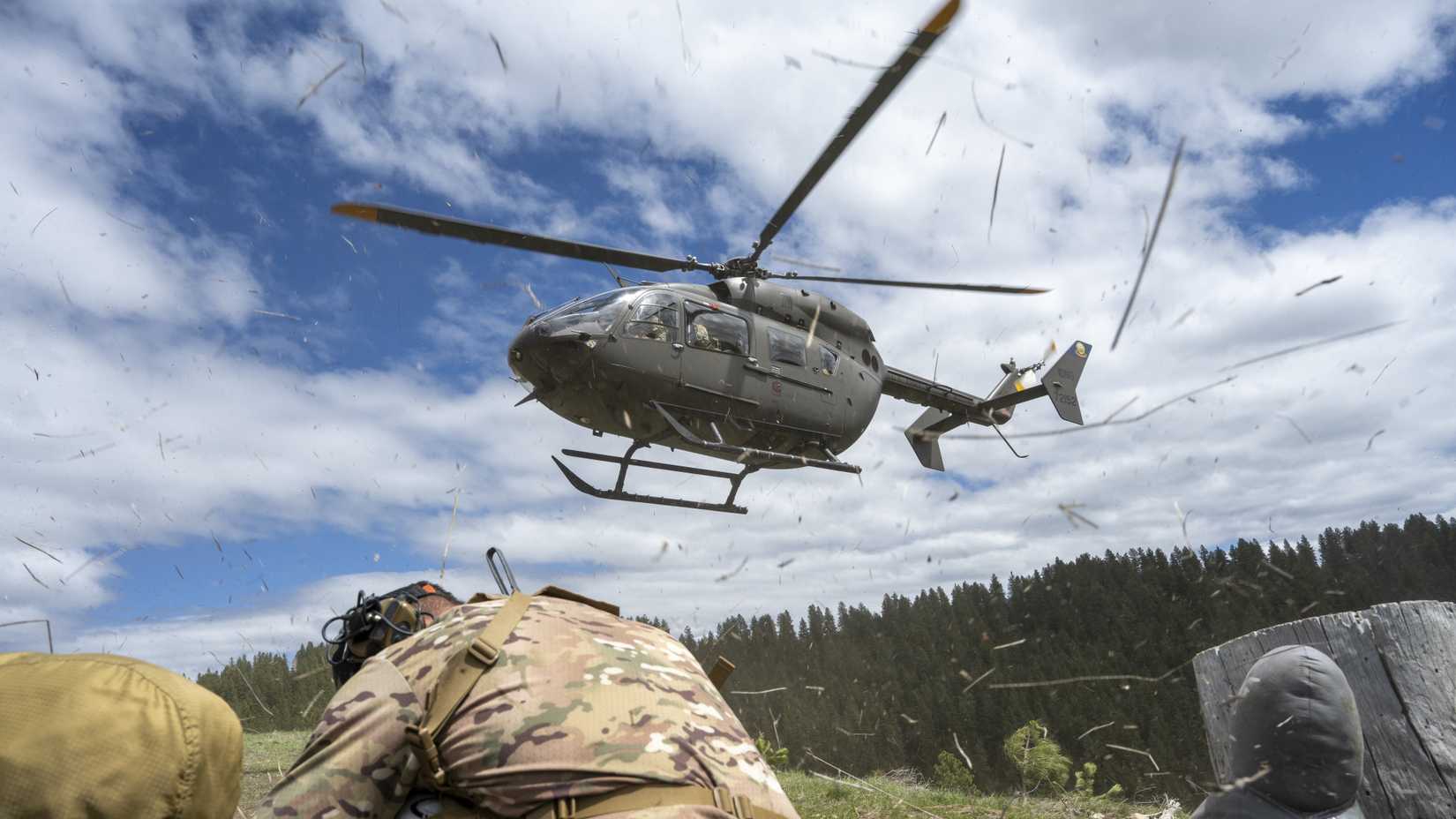Special Warfare Tactical Air Control Party Airmen ait for a IDARNG UH-72 Lakota to land.