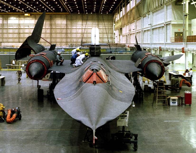 This is a head-on view of the NASA-Dryden Flight Research Center (DFRC) SR-71 with the Linear Aerospike SR Experiment (LASRE) pod held over it's attachment points on the aircraft for a fit-check.