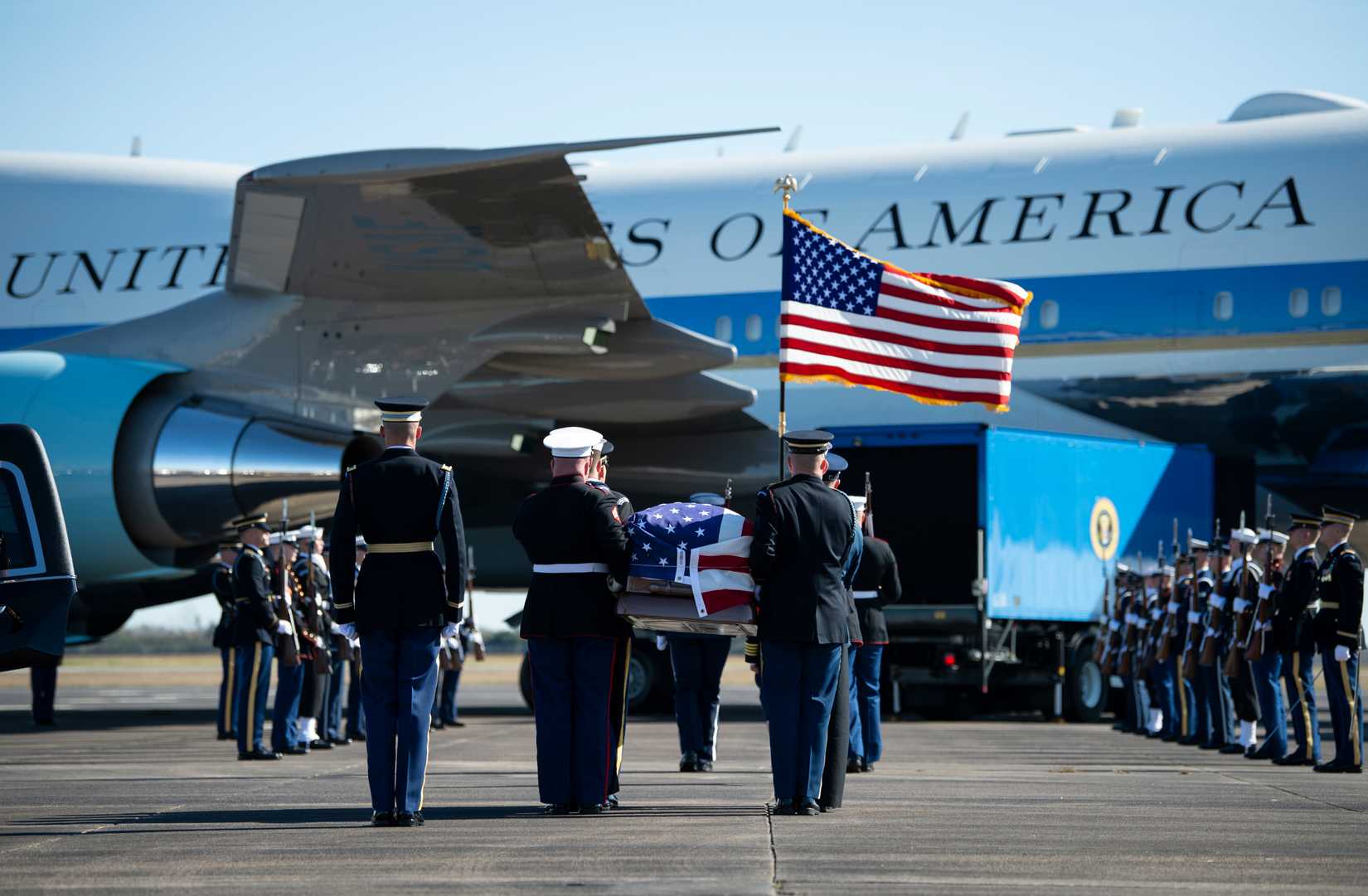 U.S. service members with the carry the casket of former U.S. President George H.W. Bush to an Air Force VC-25 aircraft during a departure ceremony, Dec. 3, 2018.