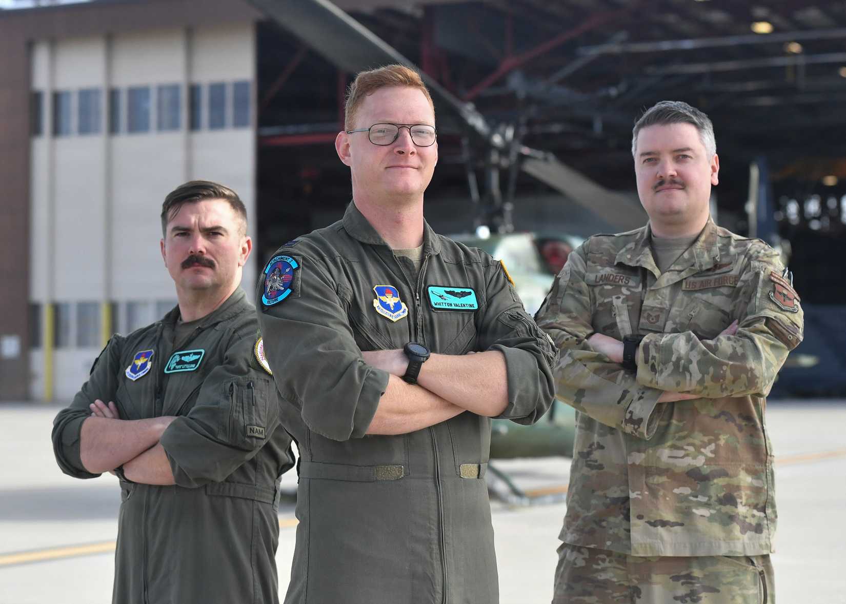 UH‑1N Huey instructor pilots stand with a special missions aviator, in front of a UH‑1N Huey at Kirtland Air Force Base.-1
