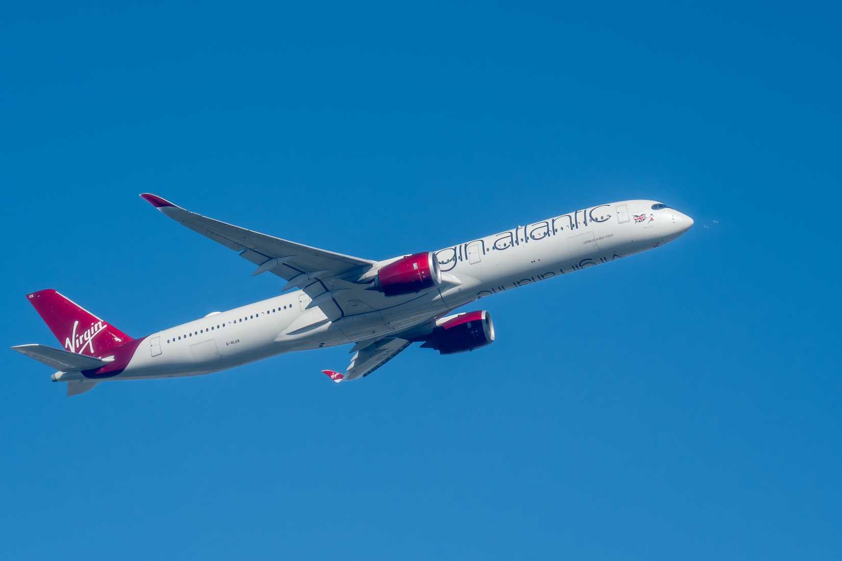 Virgin Atlantic Airbus A350-1000 XWB Commercial Jet Climbing Against a Blue Sky.