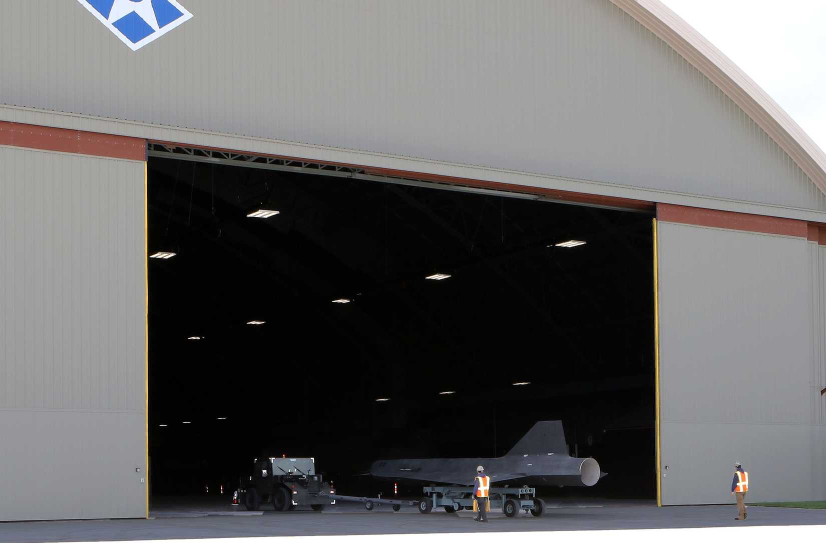 Restoration staff move the Lockheed D-21B into the new fourth building at the National Museum of the U.S. Air Force 