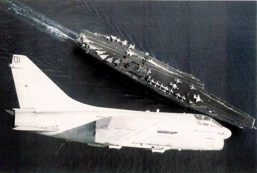 A U.S. Navy LTV Corsair II from Attack Squadron 146 Blue Diamonds flying over its parent aircraft carrier USS Kitty Hawk (CV-63). VA-146 was assigned to Carrier Air Wing 9 (CVW-9) aboard the Kitty Hawk during her world cruise from 3 January to 29 June 1987.