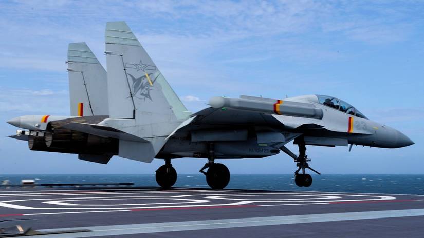 A J-15DT electronic warfare aircraft takes off from China's first electromagnetic catapult-equipped aircraft carrier, the Fujian (Hull 18).-1