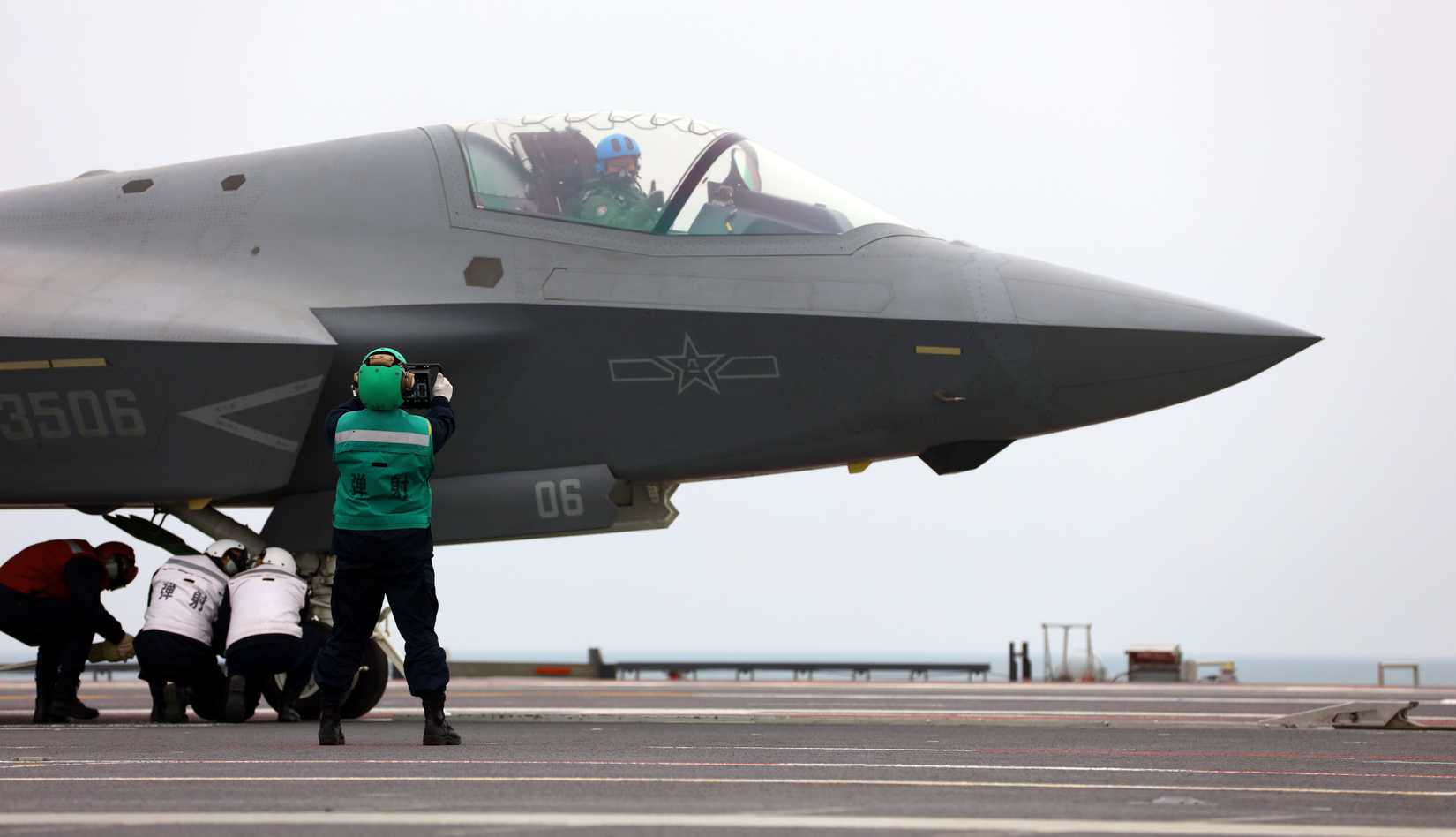 A J-35 stealth fighter jet is ready to take off from China's first electromagnetic catapult-equipped aircraft carrier, the Fujian (Hull 18)