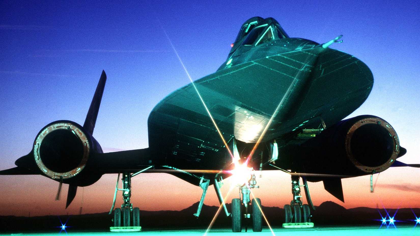 A right front view of an SR-71B aircraft on the ground.