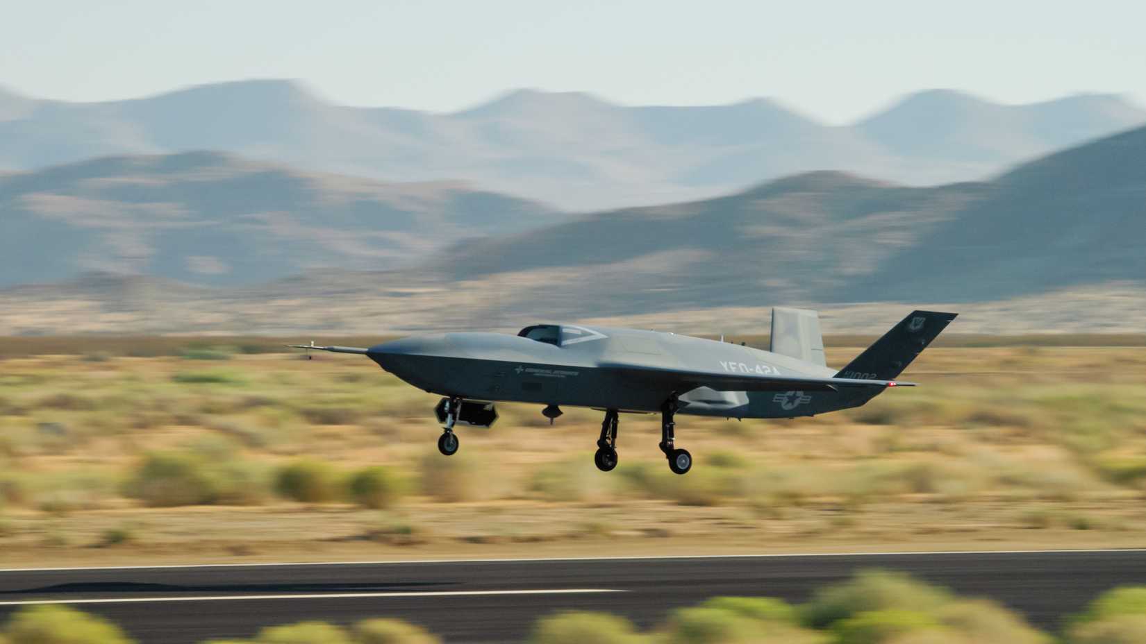 A YFQ-42A Collaborative Combat Aircraft takes off during flight testing at a California test location.