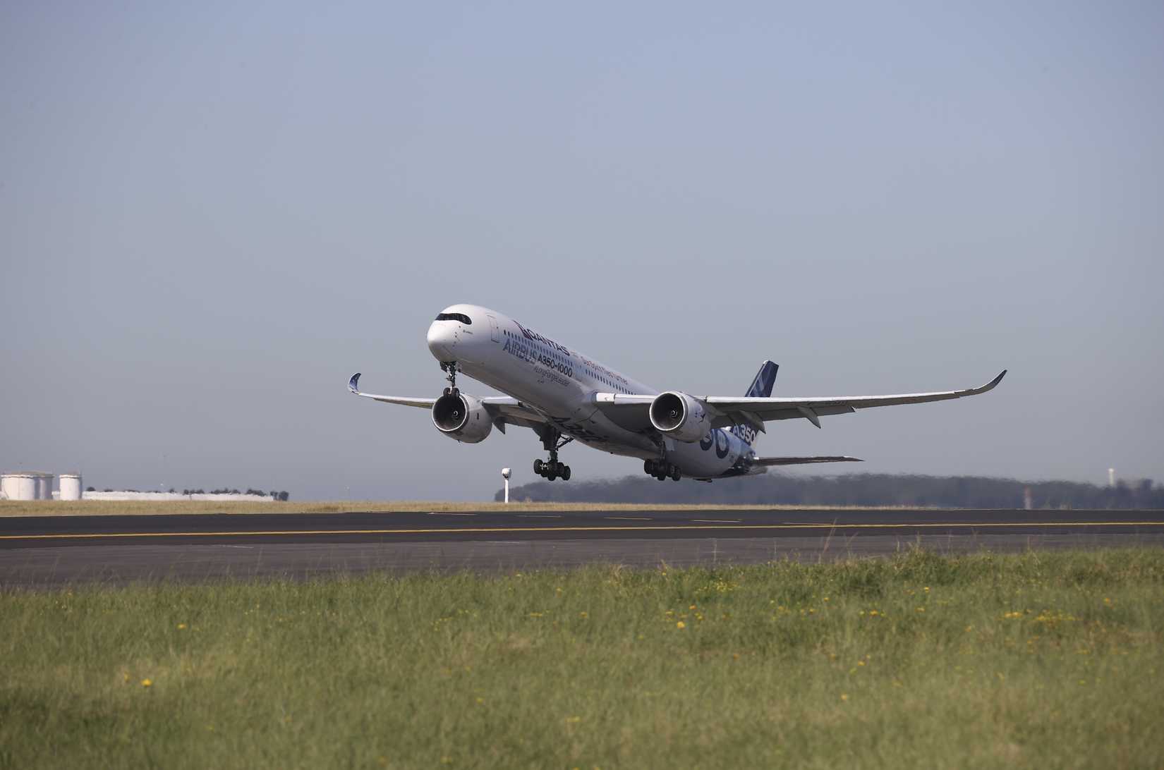 Airbus A350-1000 with Qantas logo taking off