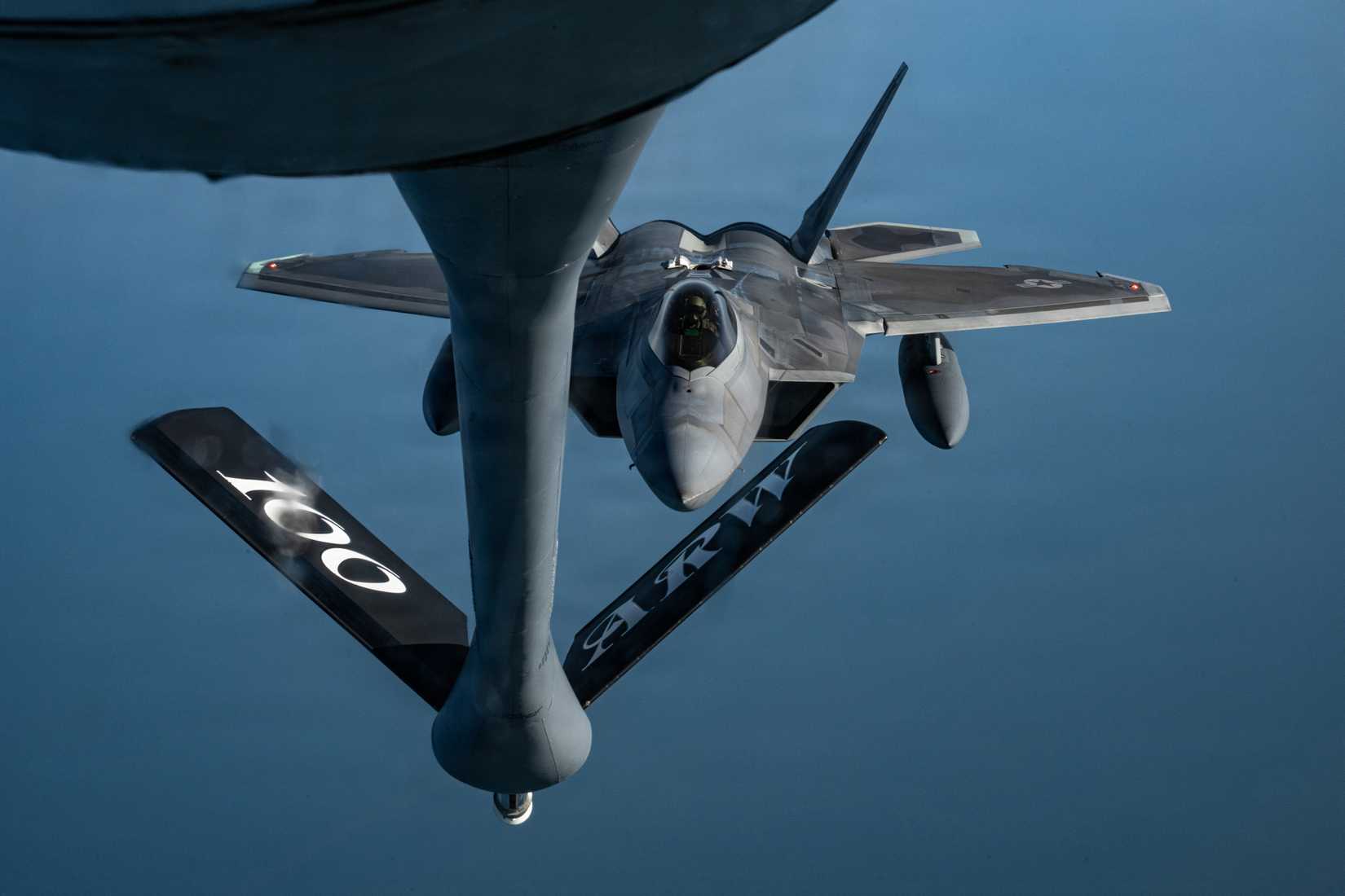 Air Force 1st Fighter Wing F-22 Raptor approaches a 100th Air Refueling Wing KC-135 Stratotanker for fuel during a mission over the North Sea, March 5, 2026.