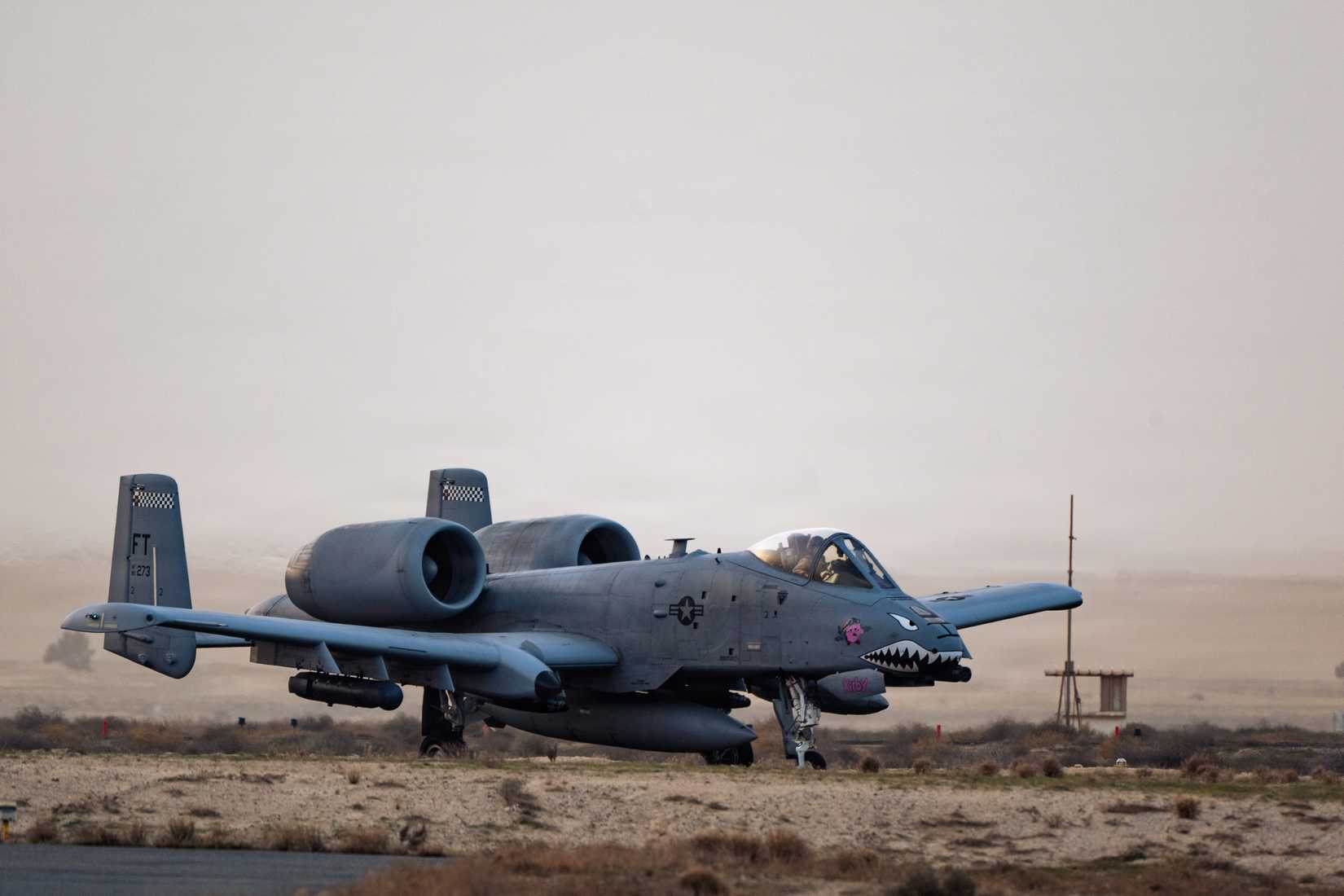Air Force A-10C Thunderbolt II aircraft assigned to the 75th Expeditionary Fighter Squadron holds short before taxiing at a base in the U.S. Central Command.