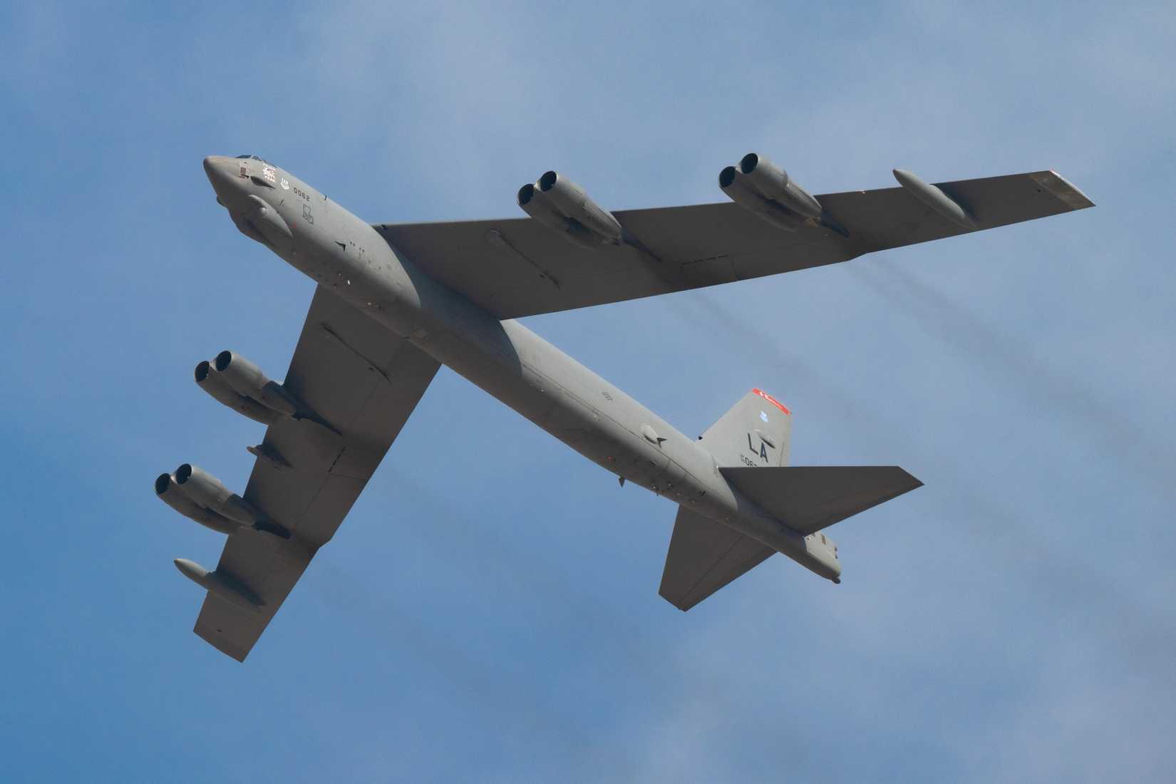 Air Force B-52 Stratofortress aircraft, assigned to the 96th Bomb Squadron from Barksdale Air Force Base, Louisiana, flies over spectators at the Dubai Airshow 2025.