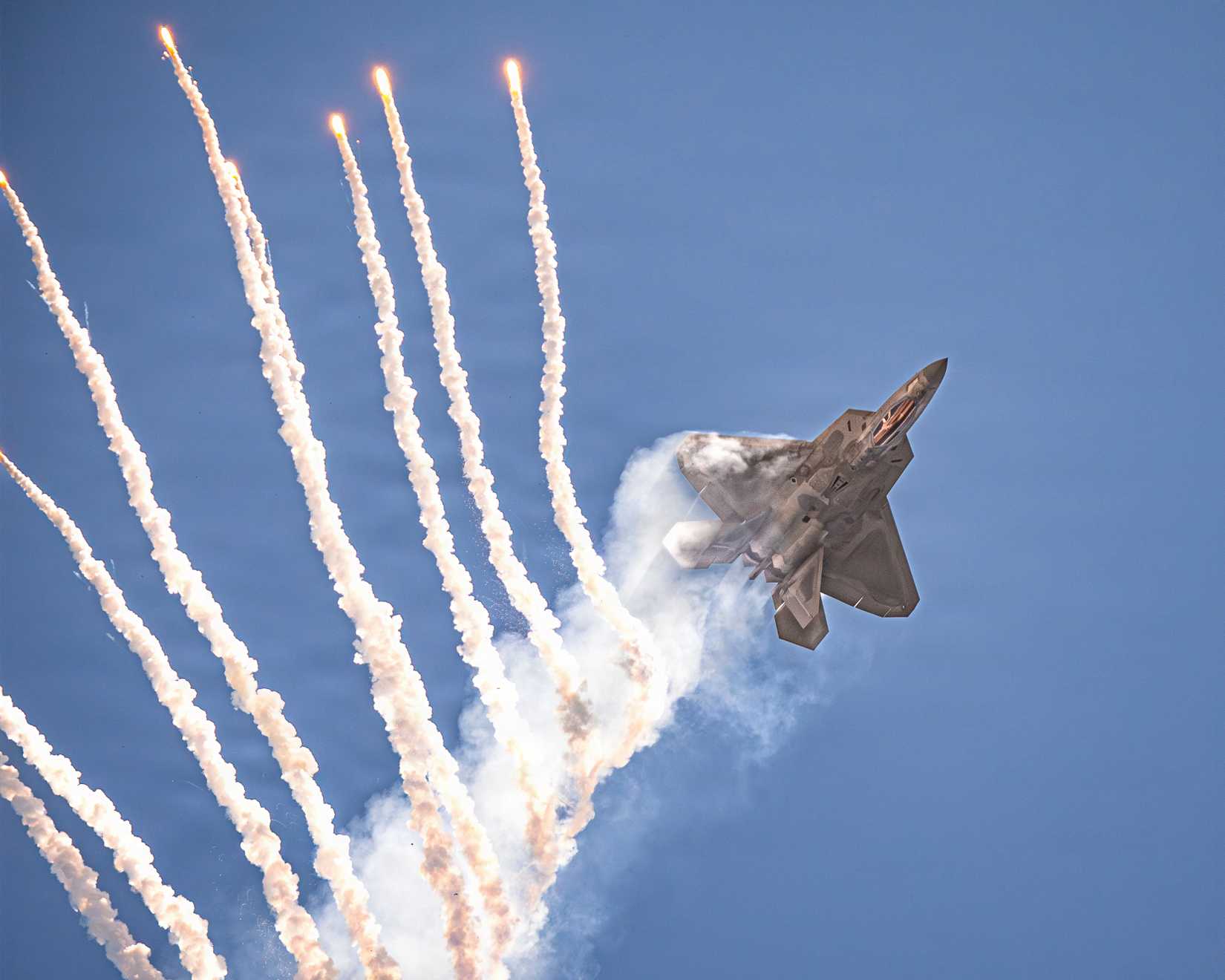 Air Force Capt. Nick “Laz” Le Tourneau, pilot and commander of the F-22 Raptor Aerial Demonstration Team, performs an aerial demonstration.-1