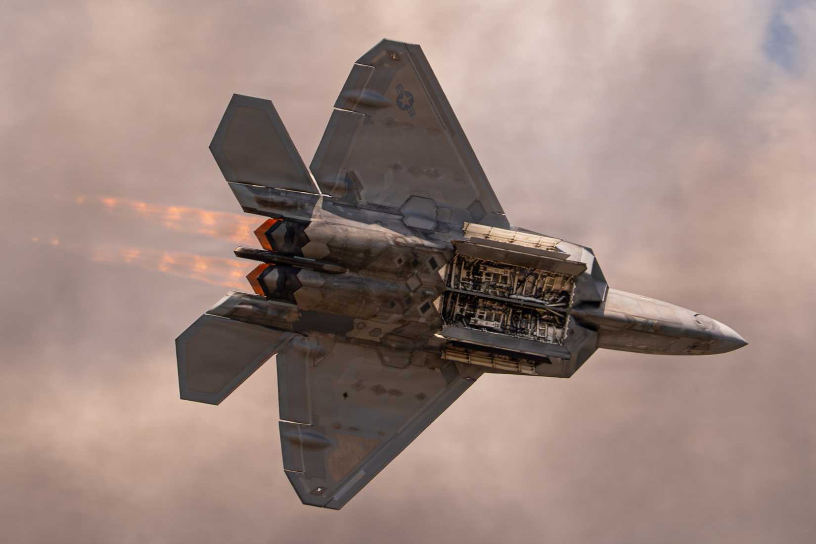 Air Force Capt. Nick “Laz” Le Tourneau, pilot and commander of the F-22 Raptor Aerial Demonstration Team, performs an aerial demonstration during the 52nd Annual SUN 'n FUN Aerospace Expo.