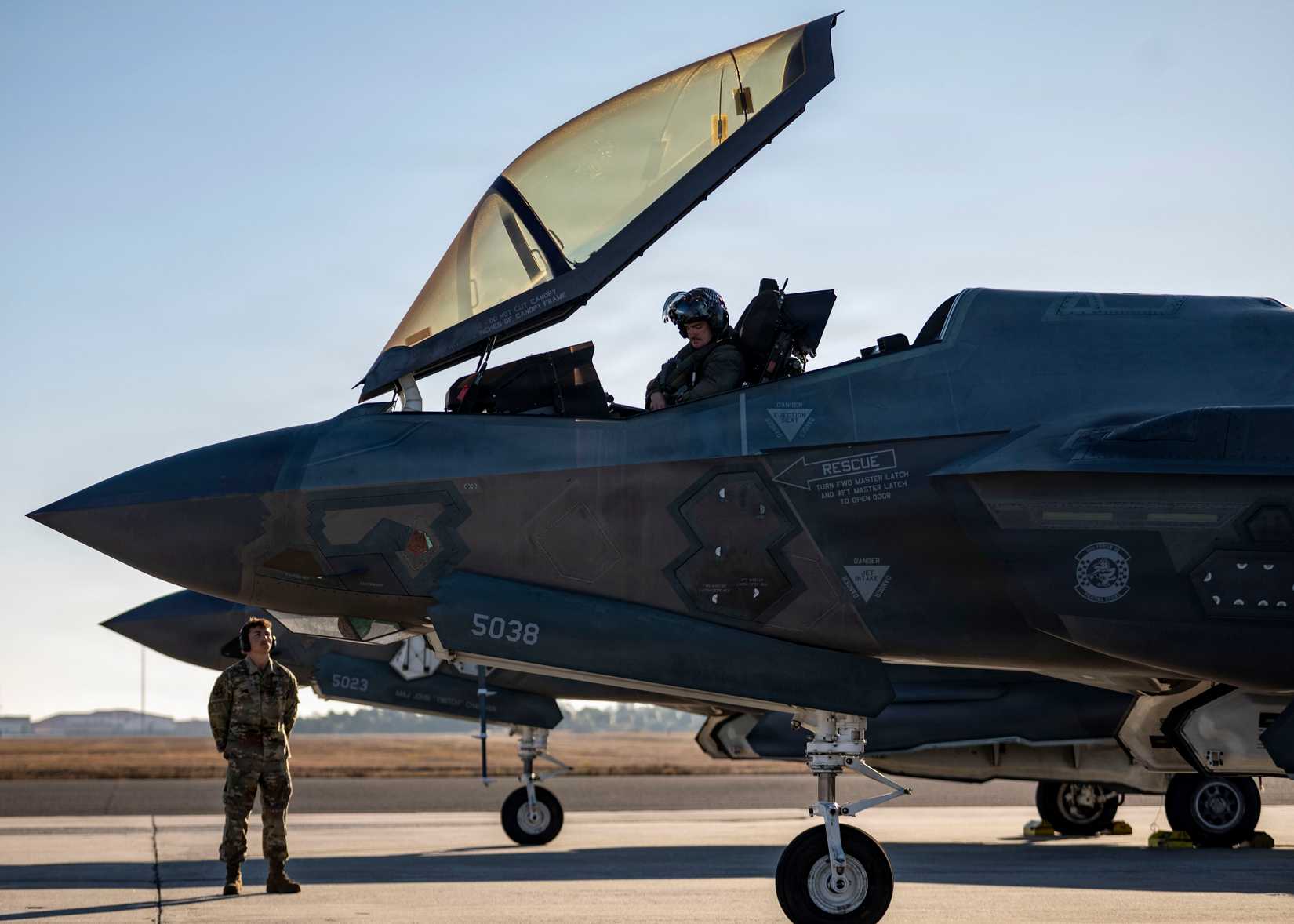 Air Force crew chief assigned to the 60th Aircraft Maintenance Unit prepares to marshal F-35A Lightning II aircraft on the flightline at MacDill Air Force Base, Florida, Feb. 11, 2026.