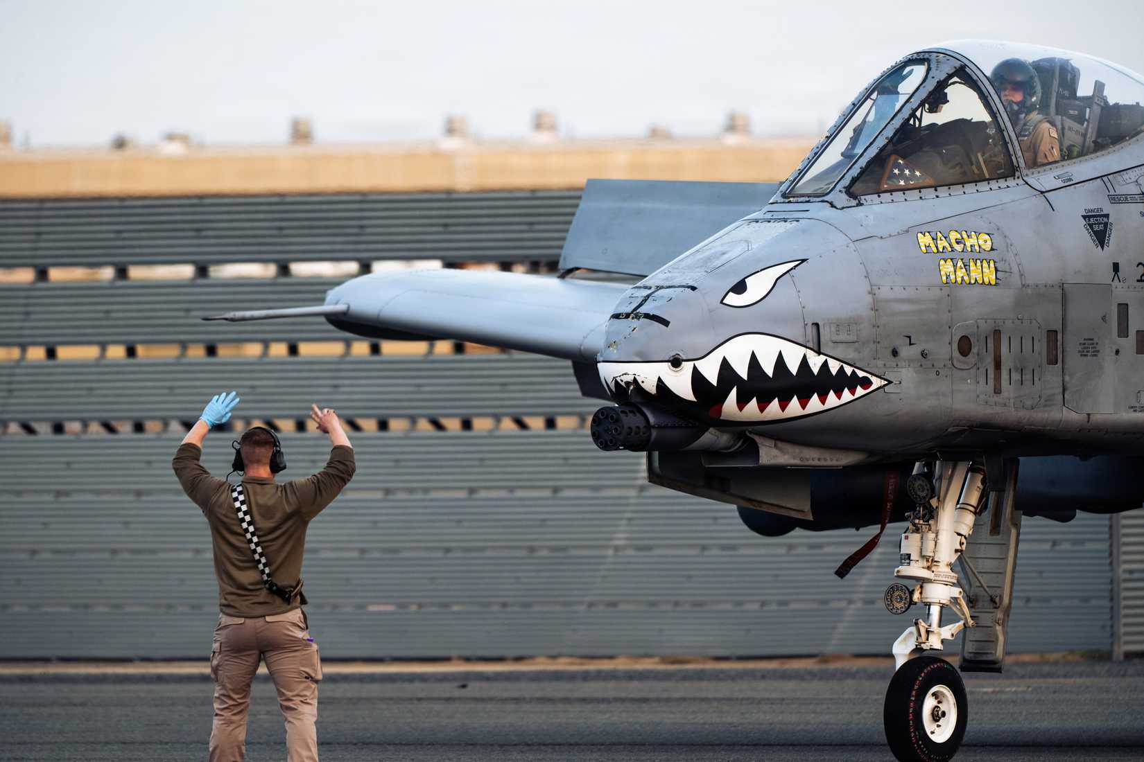 Air Force crew chief marshals an A-10C Thunderbolt II aircraft at a base in the Central Command area of responsibility, Jan. 29, 2026.