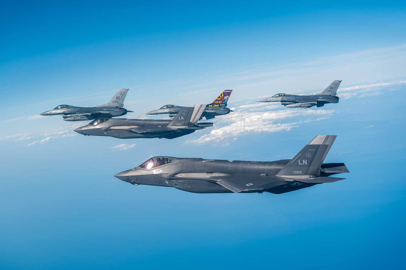 Air Force F-35 Lighting IIs and F-16 Fighting Falcons assigned to the 48th and 31st Fighter Wings respectively fly in during Exercise Combined Strike 25 along the coast of Italy, August 18, 2025.