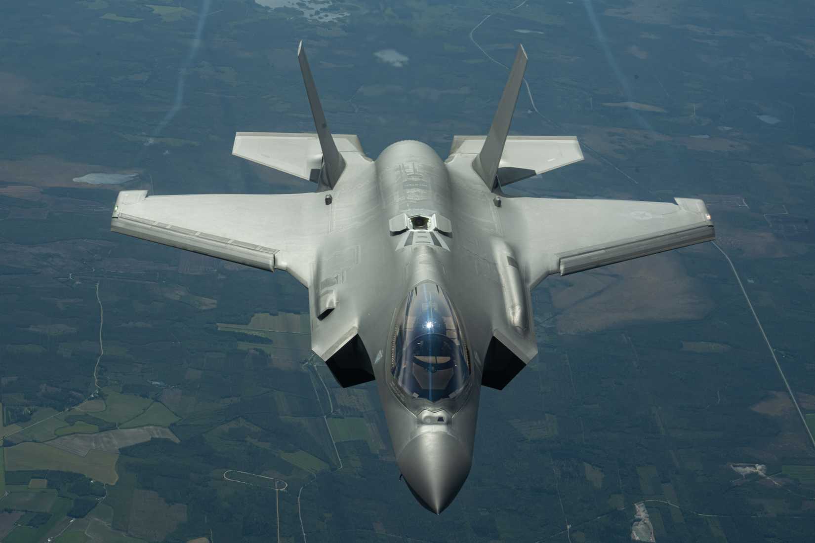 Air Force F-35A Lightning II from the 48th Fighter Wing, RAF Lakenheath, England, descends after receiving fuel from a KC-135 Stratotanker.