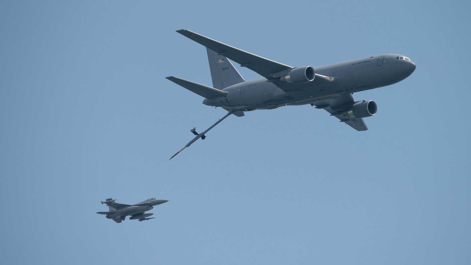 Air Force KC-46 Pegasus air refueling tanker from the 108th Wing performs an air demonstration with an F-16C Fighting Falcon fighter jet from the 177th Fighter Wing.