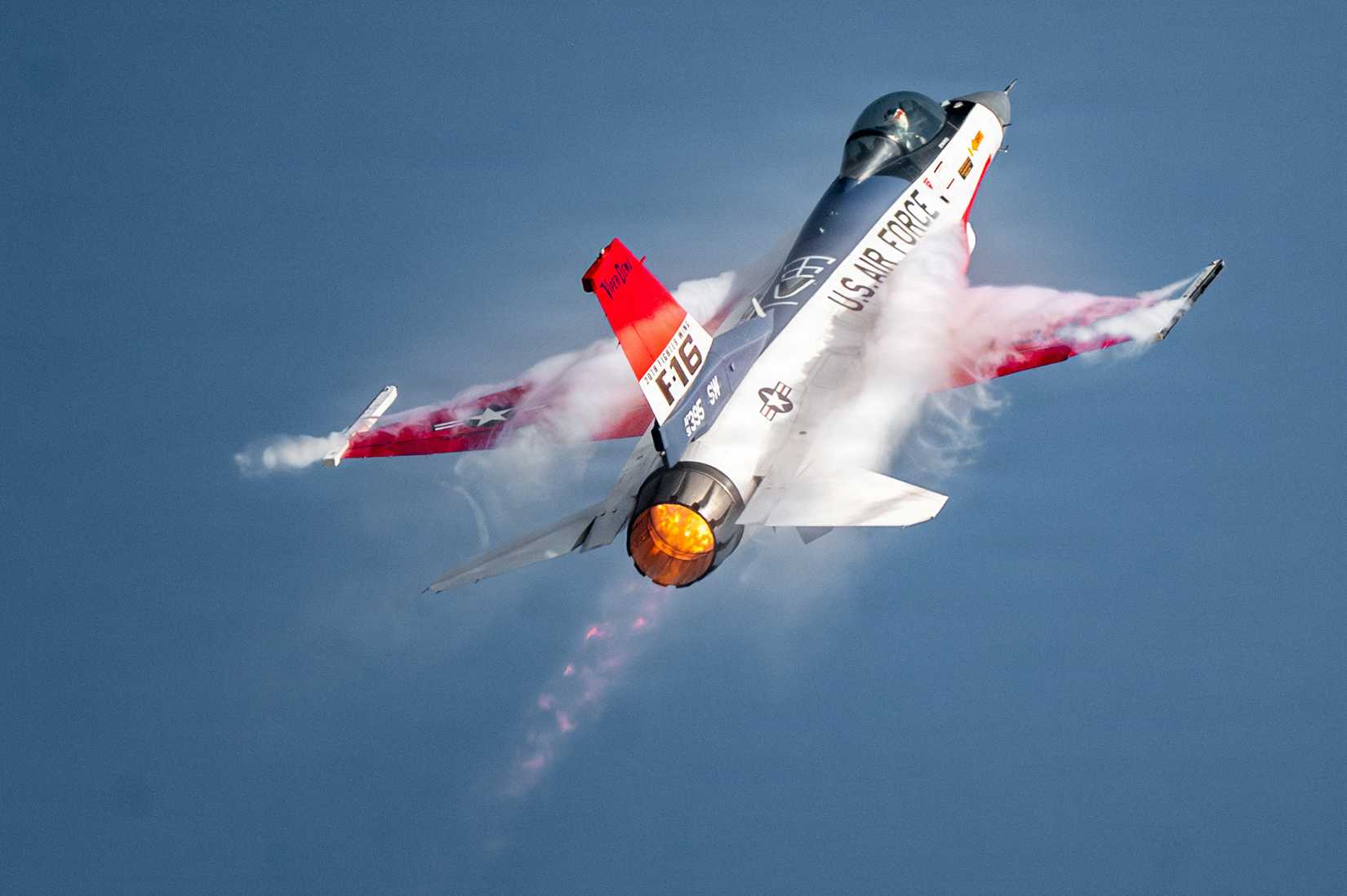 Air Force Maj. Taylor “FEMA” Hiester, F-16 Viper Demonstration Team commander and pilot, performs aerial maneuvers in a U.S. Air Force F-16C Fighting Falcon.