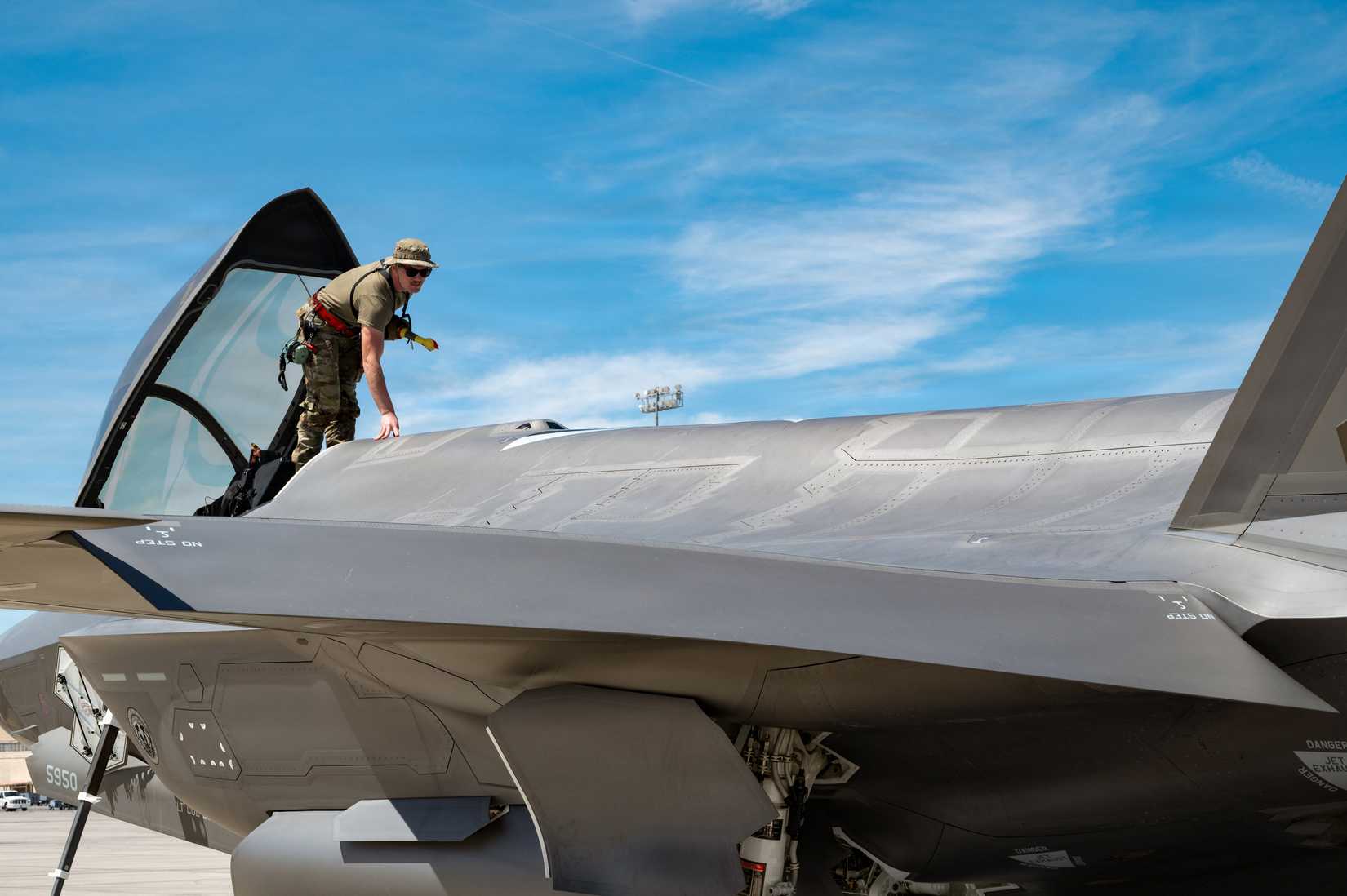 Air National Guard Airman, assigned to the Wisconsin Air National Guard’s 115th Fighter Wing, performs a post flight inspection of the air-to-air refueling door at Nellis Air Force Base.