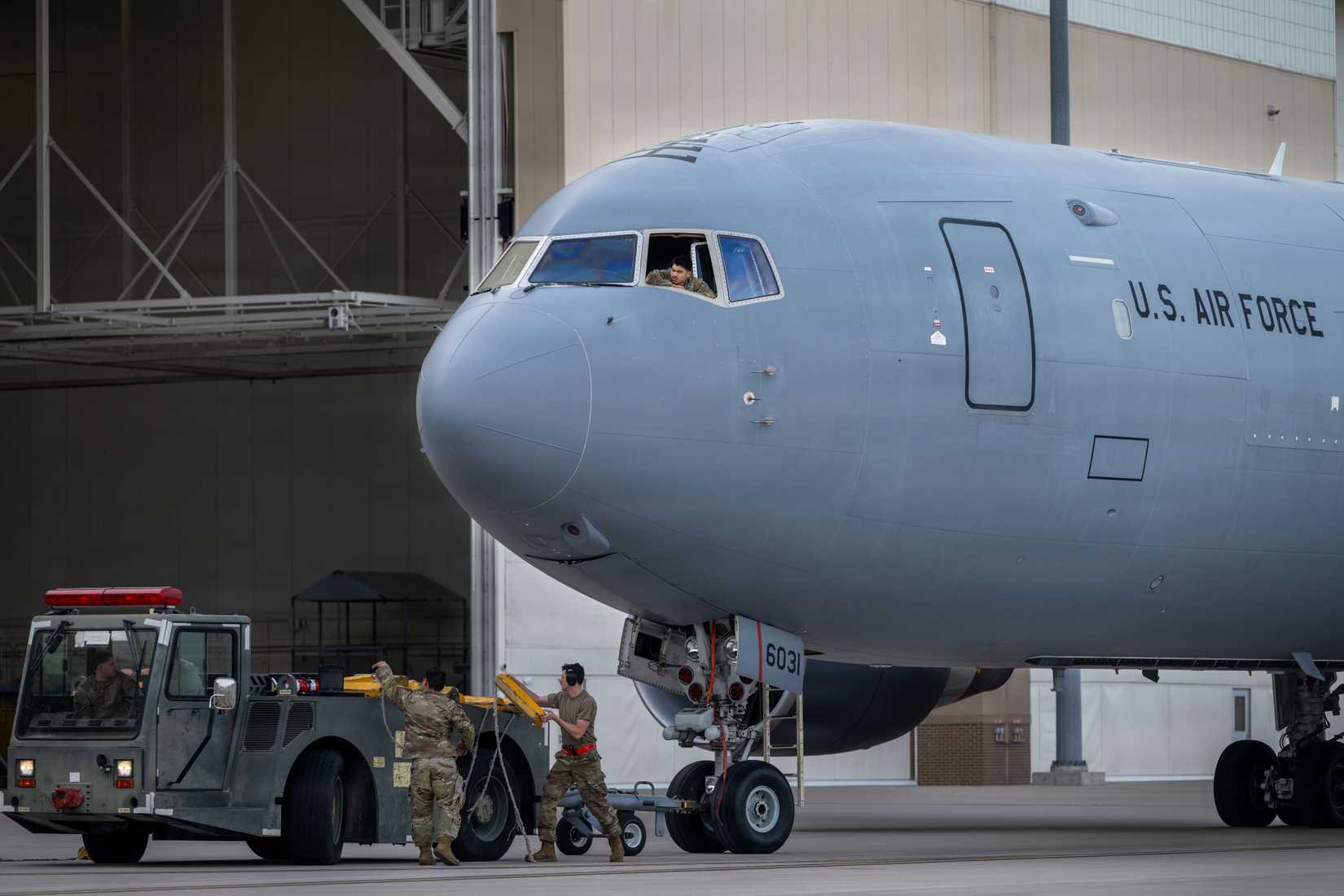 Airmen stow chocks from a KC-46A Pegasus during a weather evacuation on the flightline at McConnell Air Force Base, Kansas, April 17, 2026.