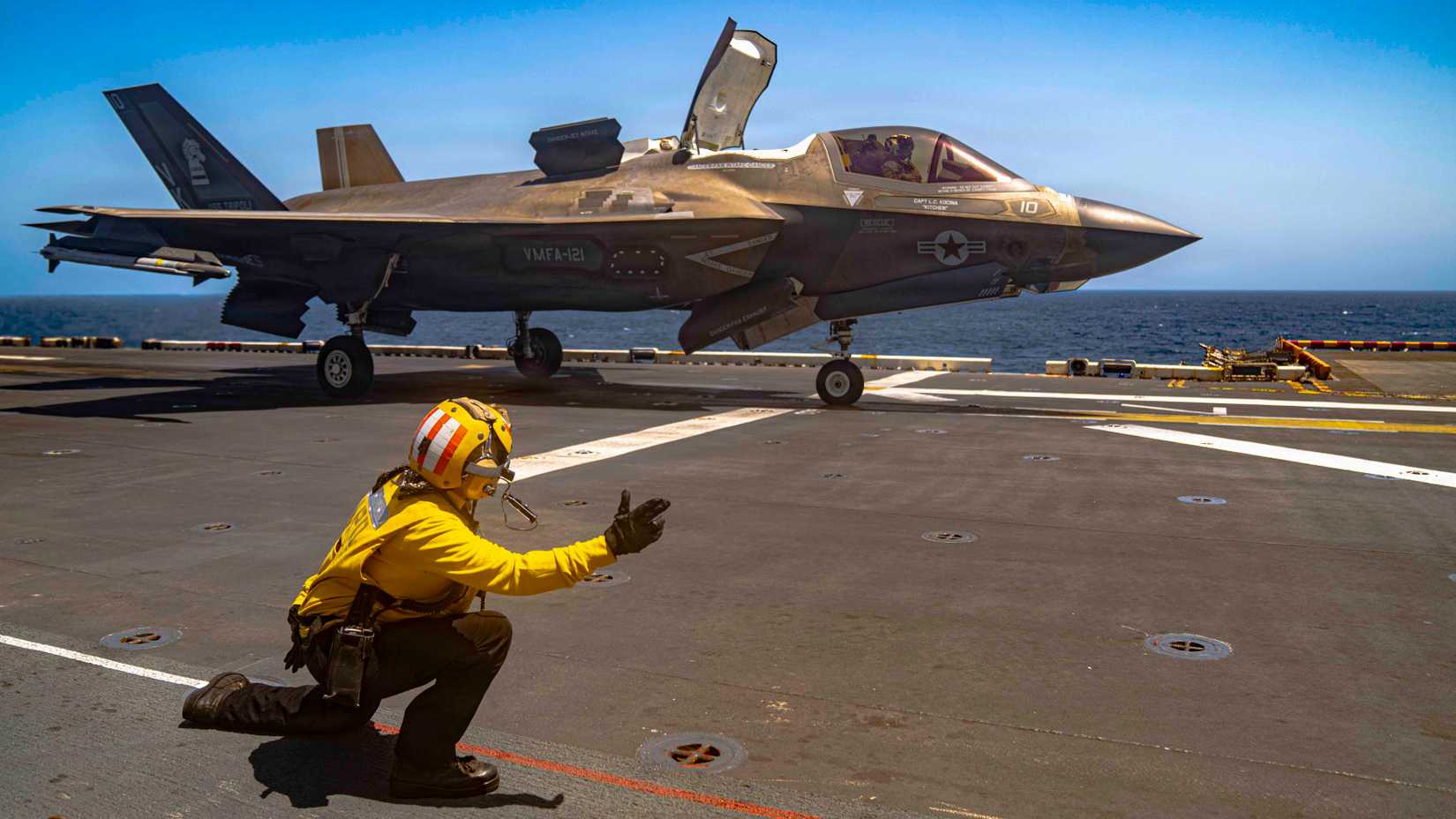 An F-35B Lighting II, attached to Marine Fighter Attack Squadron (VMFA) 121, takes off from the flight deck of America-class amphibious assault ship USS Tripoli.